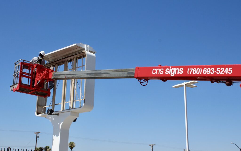 Crane truck used for CNS Signs installation services