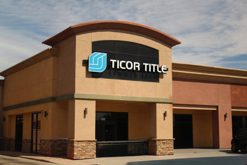 Exterior of a Ticor Title office featuring front-lit channel letter signage on a modern tan building.