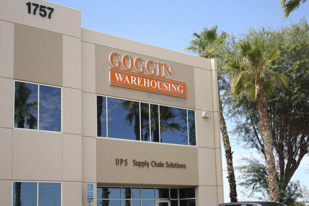 Channel letter sign for Goggin Warehousing on a multi-story building exterior